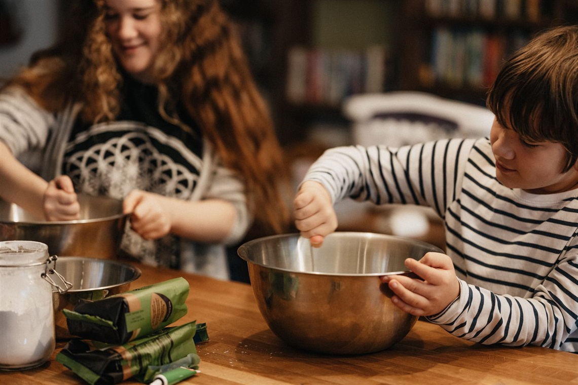 two kids stirring ingredients